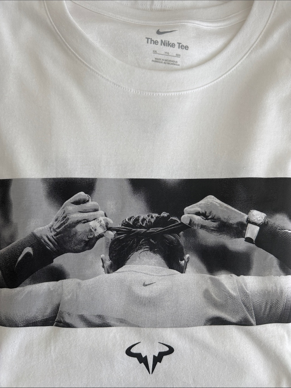 Nike Men’s White Short-Sleeve Graphic Tee with Black Rafael Bull Motif
